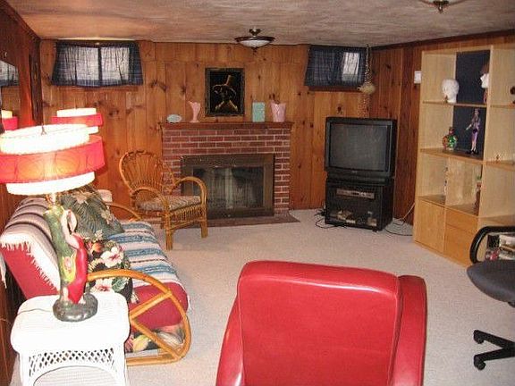Family room with tongue and groove knotty pine paneling