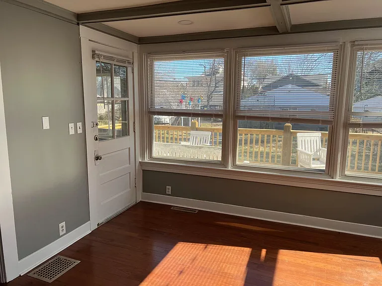 sunroom with door to deck