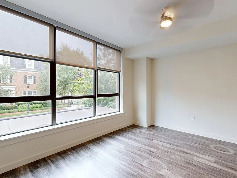 Apartment Living Room with wood flooring.