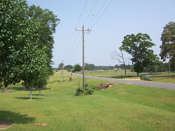 FRONT YARD AT THE HIGHWAY