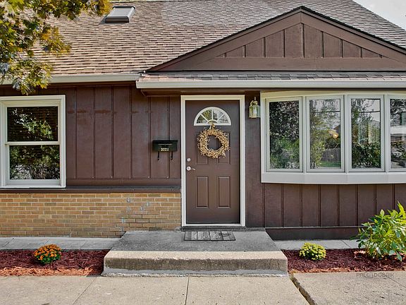 Close up of the front door and bay window