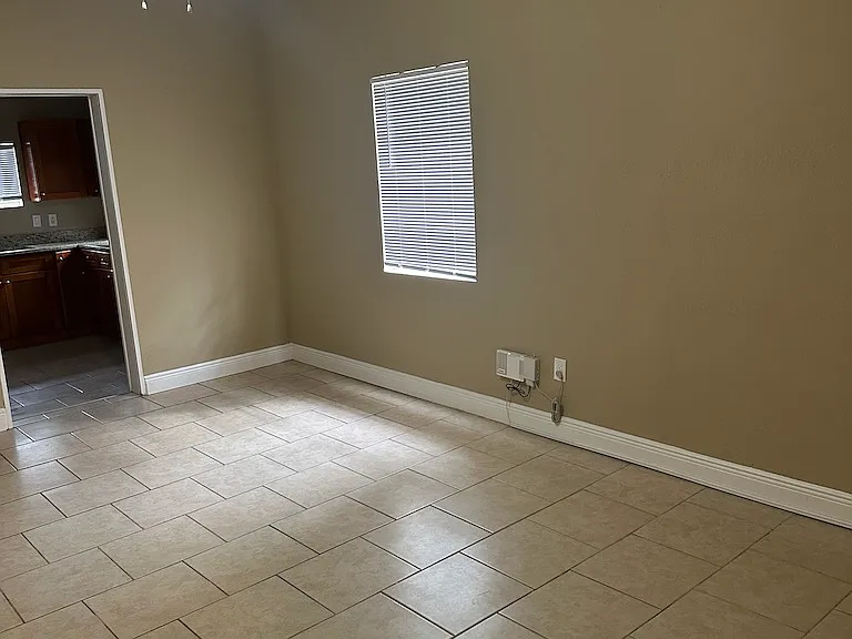 Large tiled family/dining area