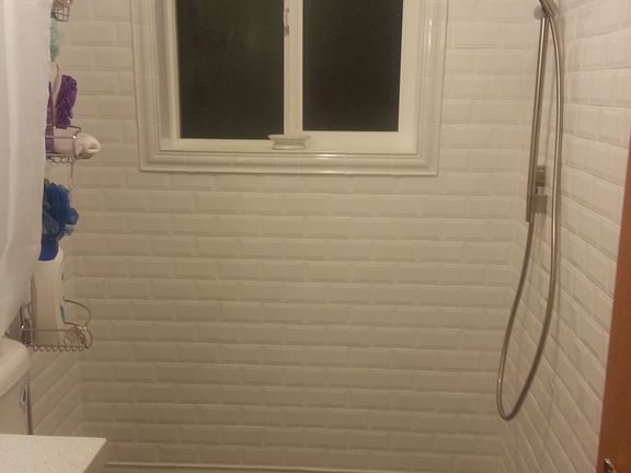 Renovated  purple bathroom