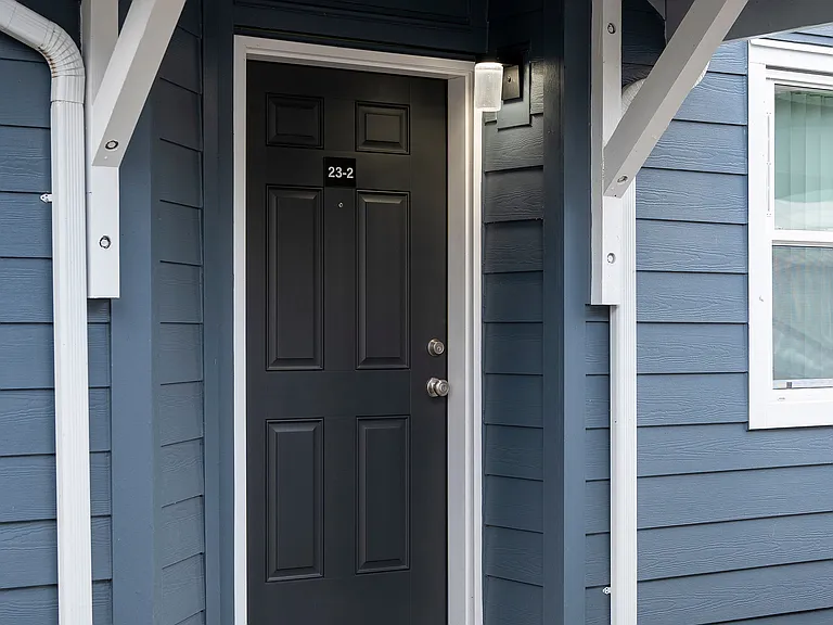 Step into contemporary comfort through this stylish entrance.