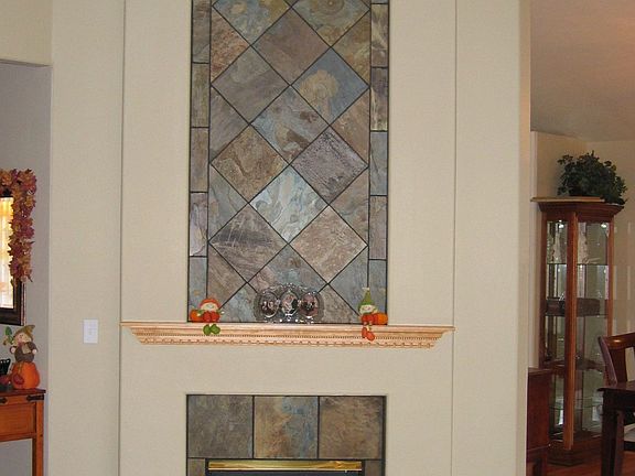 Custom slate tile on gas fireplace