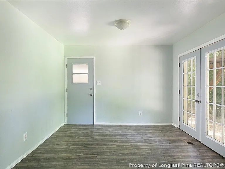 back room glass door open to the patio