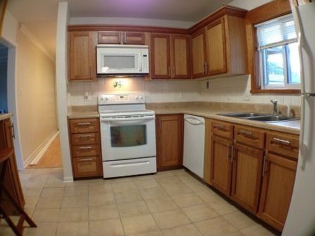Updated kitchen with cherry wood cabinets
