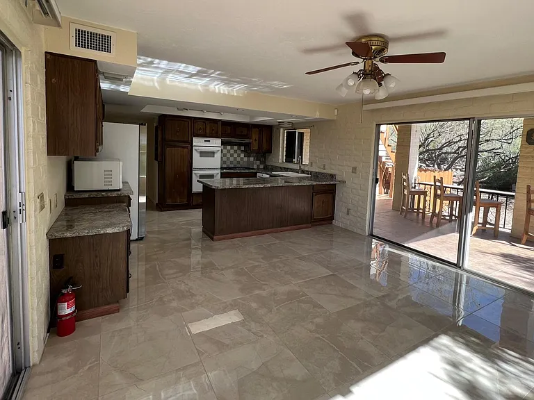 Dinning area with sliding doors to rear patios.
