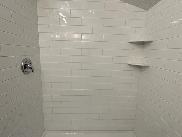 Tiled, spacious shower stall