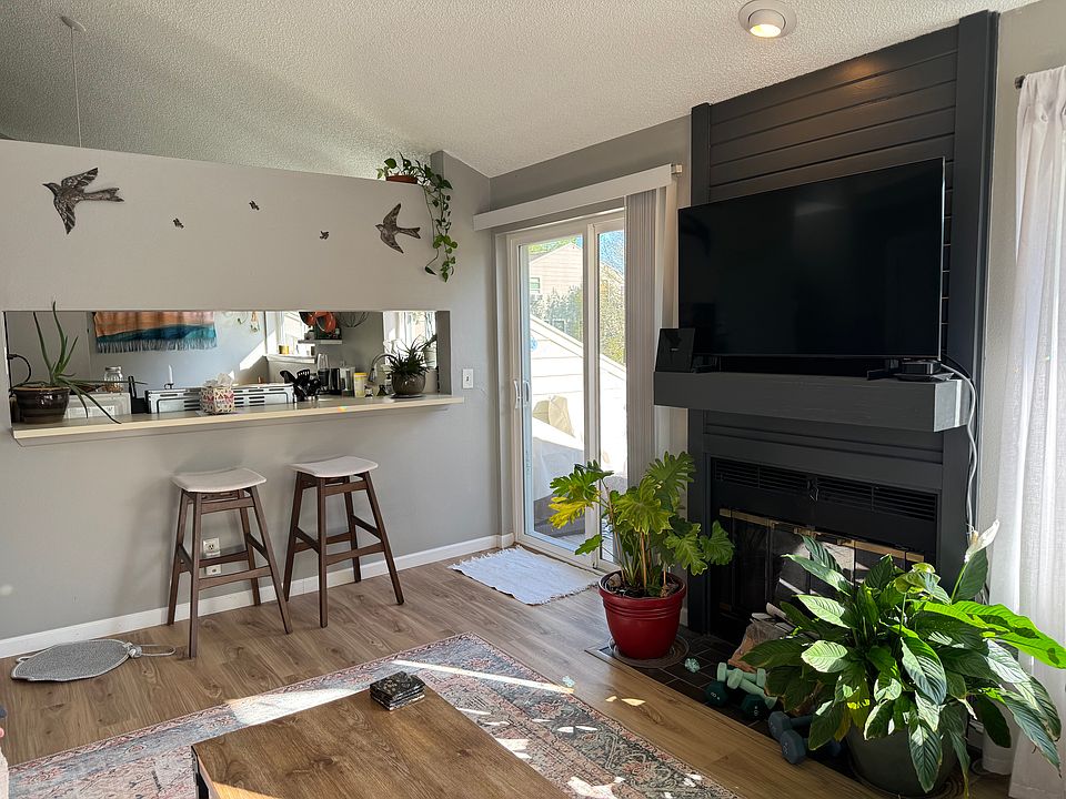 Living Room, view to kitchen and balcony