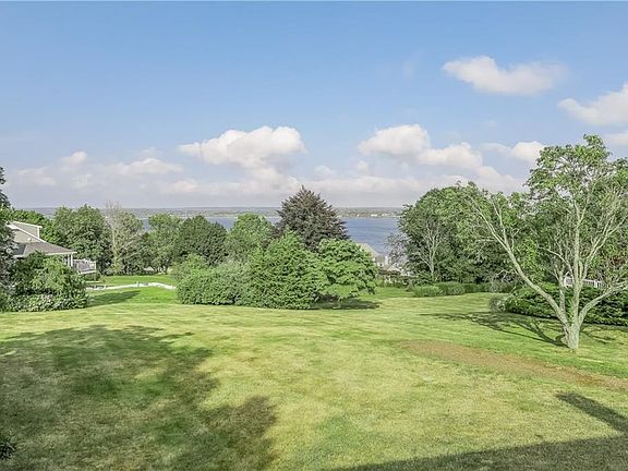 The back yard and deck overlooks the Sakonnet River; beautiful at any time of day!
