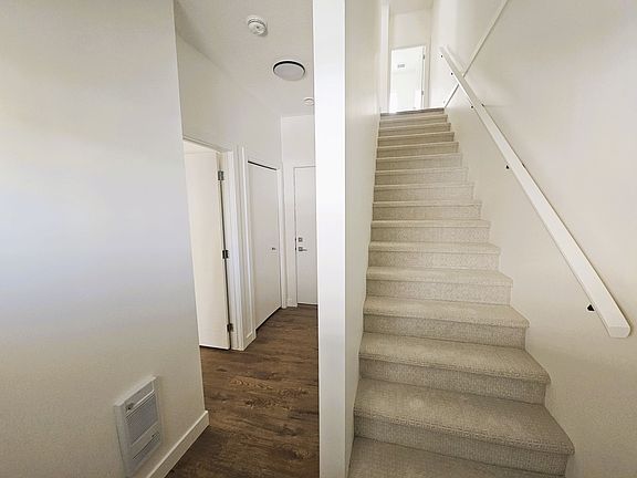 View from the front door to garage, office and stair to floor 1