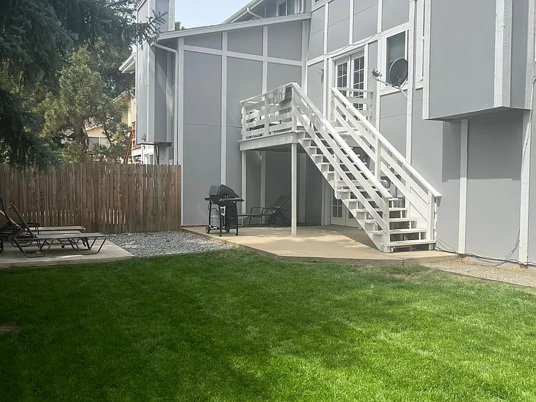 Beautiful backyard with deck and multiple concrete patios