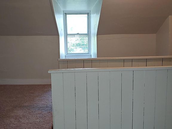 Carpeted attic for storage or office