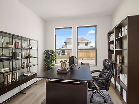 Flexible front room perfect for a home office, playroom, formal dining, reading nook, or hobby space