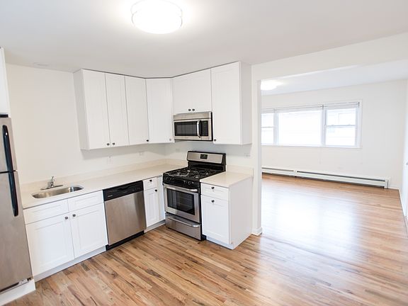 Open kitchen with bright family room