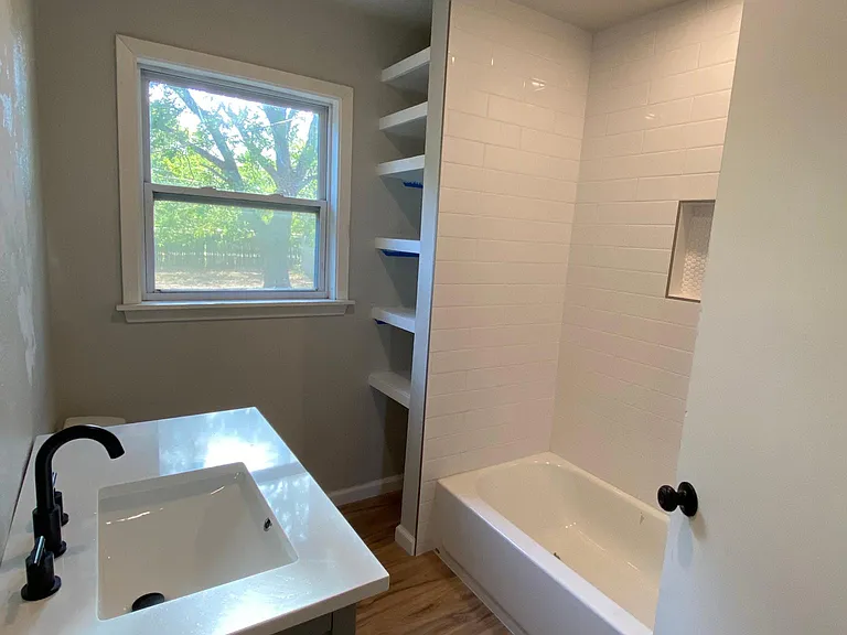 Just renovated bathroom with tub.