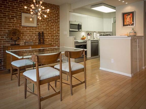 Dining Area Flows into Open, Modern Kitchen.