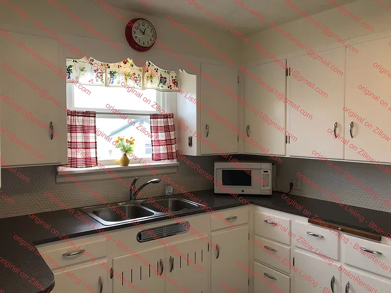 Lots of cupboard storage in kitchen.