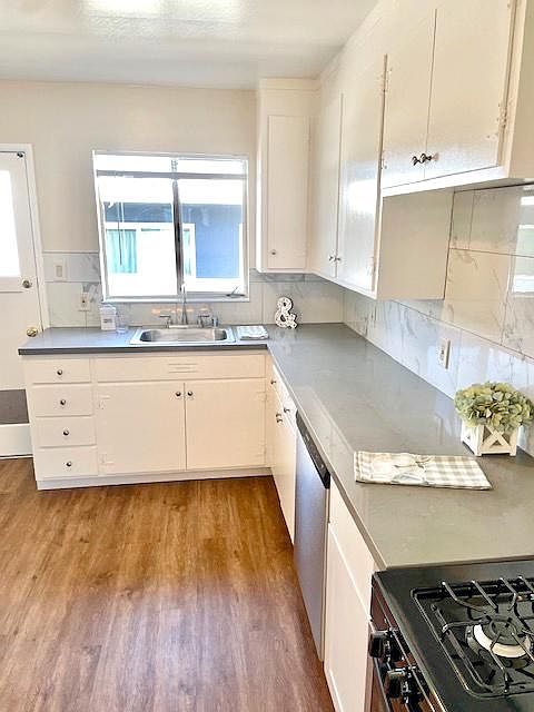 Kitchen with quartz countertops and stainless appliances