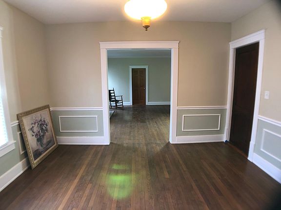This is the dining room looking toward the living room. The swinging door at right goes to the kitchen.