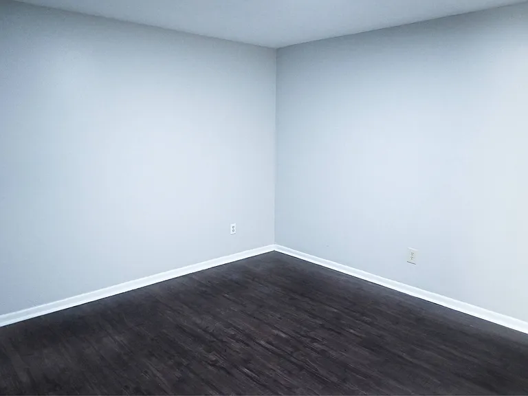 Bedroom with white walls.