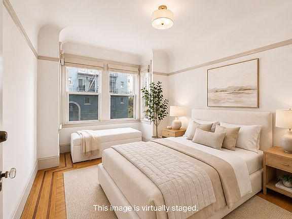 Bright & airy 2nd bedroom with view to the front of the unit