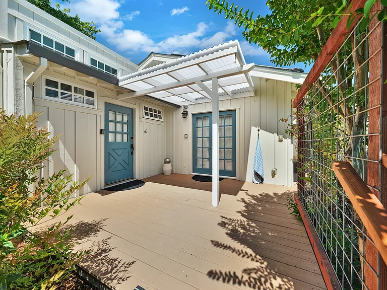 Back unit (left door into bathroom, right French doors into bedroom).