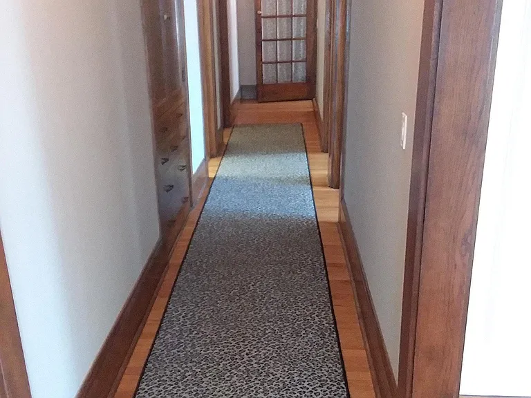 Hallway from front door to living room and bedrooms