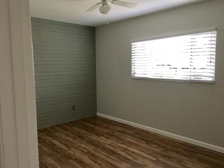 Bedroom 2 with window to front yard.