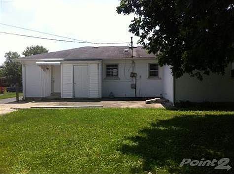 Flat back yard, perfect for pets or playground equipment and running through the sprinkler this summer.  Large exterior storage attached to home.