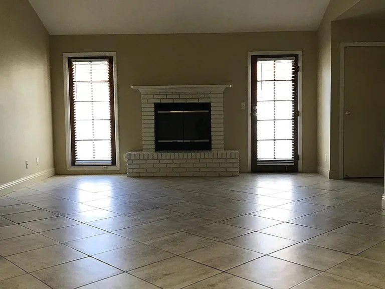 Large living room with wood burning fireplace for winter time.
House has A/C and force air heating.