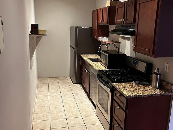Kitchen with granite counter and new dishwasher