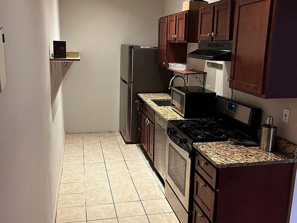 Kitchen with granite counter and new dishwasher