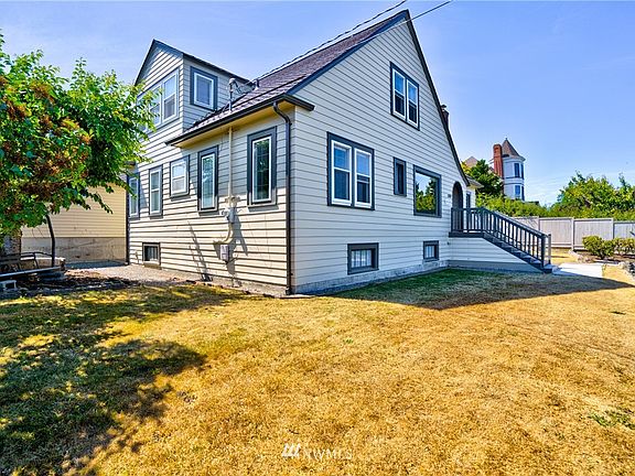 Small yard with shady tree on east side of home