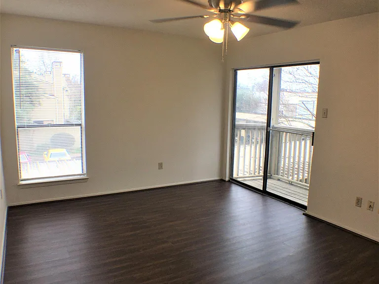 Upstairs bedroom with newly installed wood flooring