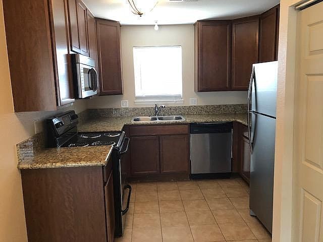 Kitchen features New Cabinetry with Granite Countertops