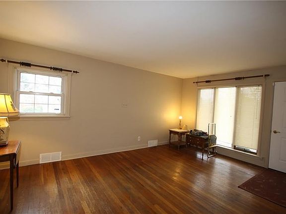 Beautiful Hardwood Floors in 12x17 Living Room w/ Floor to Ceiling Front Windows