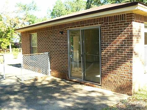 Driveway side of the home has the patio