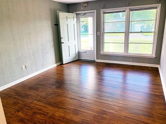 Freshly refinished wood floors and lots of natural light in