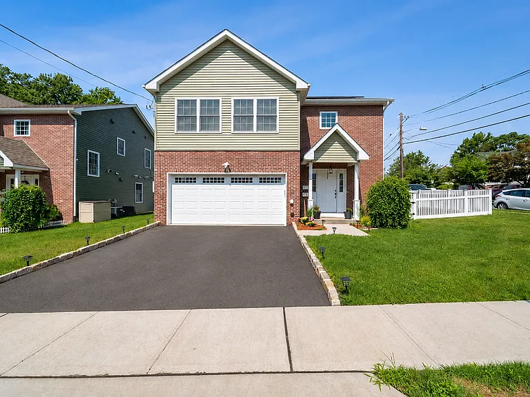 Modern second-floor residence with convenient driveway parking included