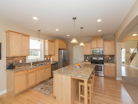 Prepare a meal on the gas stove and dine at the breakfast bar. There is recessed lighting, a walk in pantry and soft close cabinetry.
