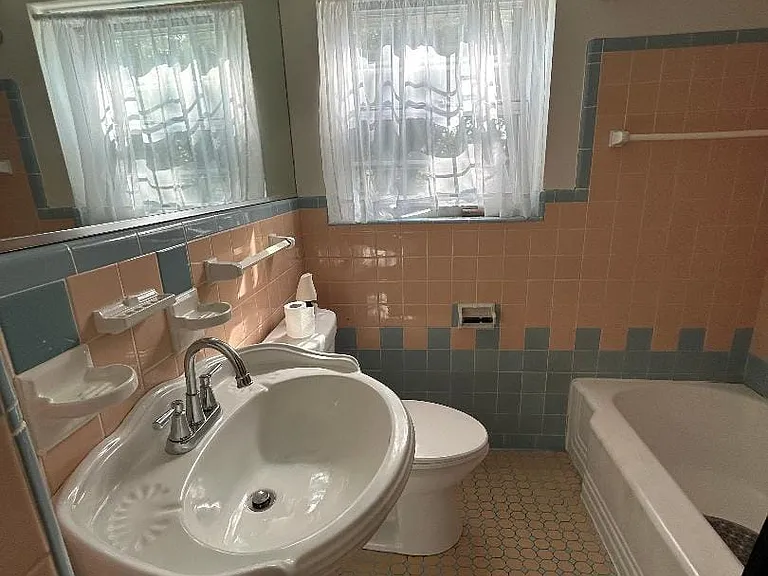 One bathroom in this unit, and it is quaint with ceramic tile, shower-tub, updated sink & toilet.