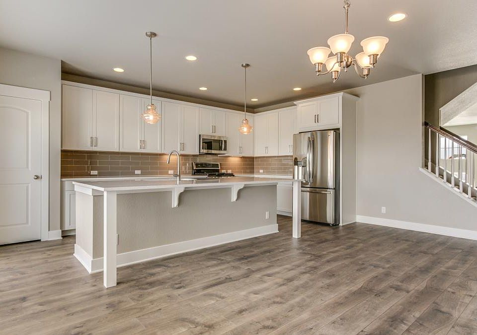 Dining Room and kitchen with large island and custom cabinet