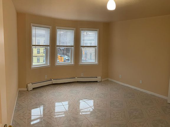Bedroom overlooking Kennedy Boulevard Western view. Multiple electric outlets. Easily fits king size bed with all necessary furniture. Newly painted. Excellent heat. Brand new windows, and blinds.