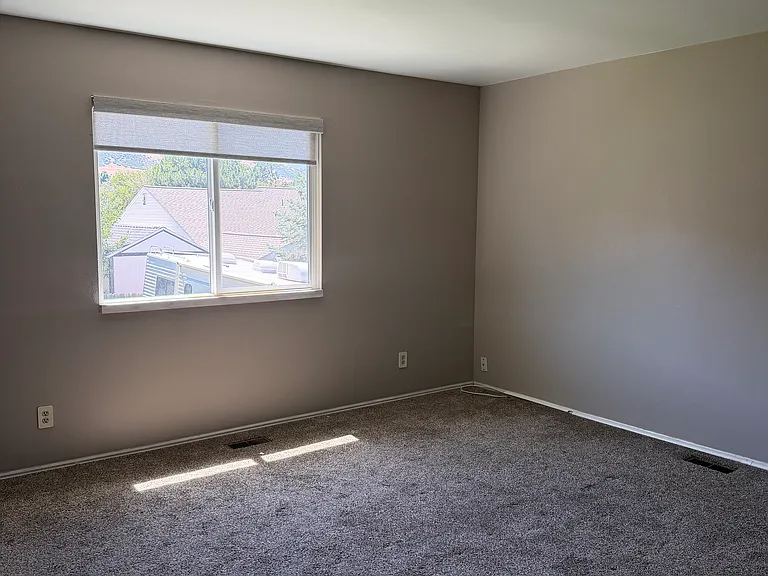 Upstairs bedroom #3, new paint, new windows, new blinds.