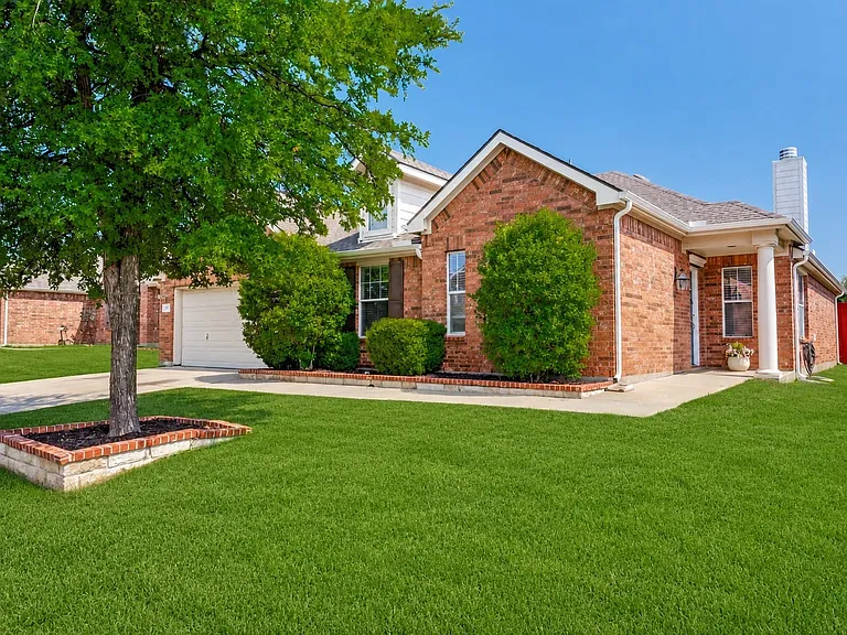 Single-story brick home in master planned community