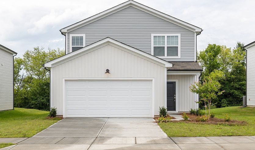 Raven Exterior TD102 features siding, covered front door and 2 car garage