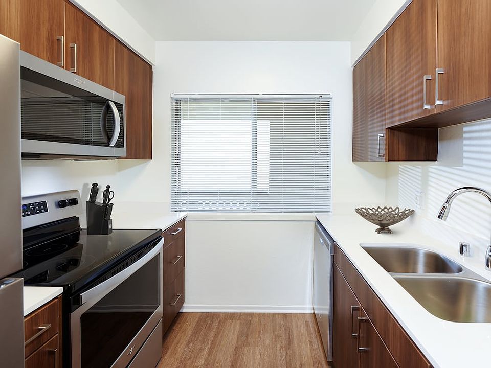 Renovated I kitchen with new cabinetry, quartz countertops, stainless steel appliances, and hard surface flooring