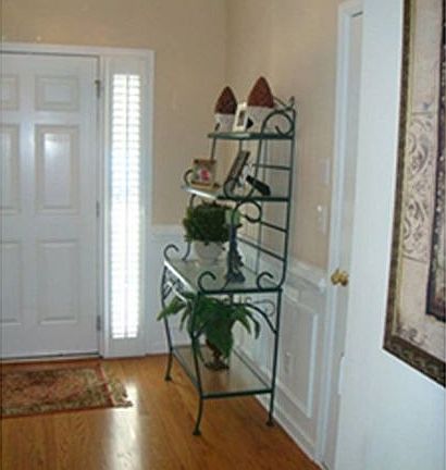 Entry foyer has hardwoods, molding, judge's paneling, more!